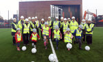 Balloch Campus - some children kicking footballs on the new pitch