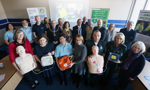 Heart start defibrillator launch group photo - 20 people with defibrillator equipment