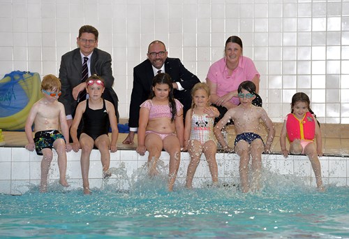 Councillors with children at pool side 