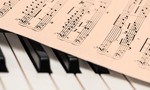 Music lessons - Picture of piano and music sheet