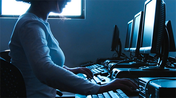 Woman sitting at a computer desk