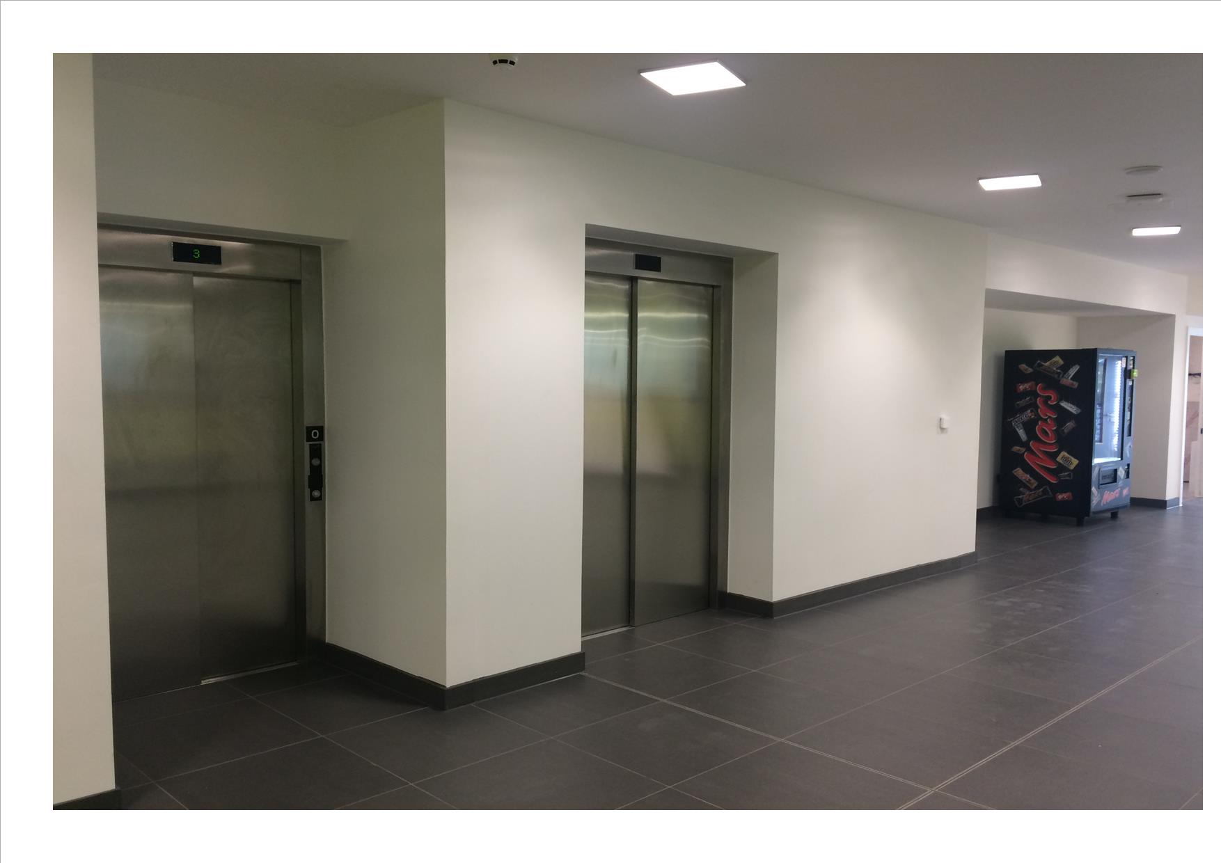 image of lifts leading to second floor