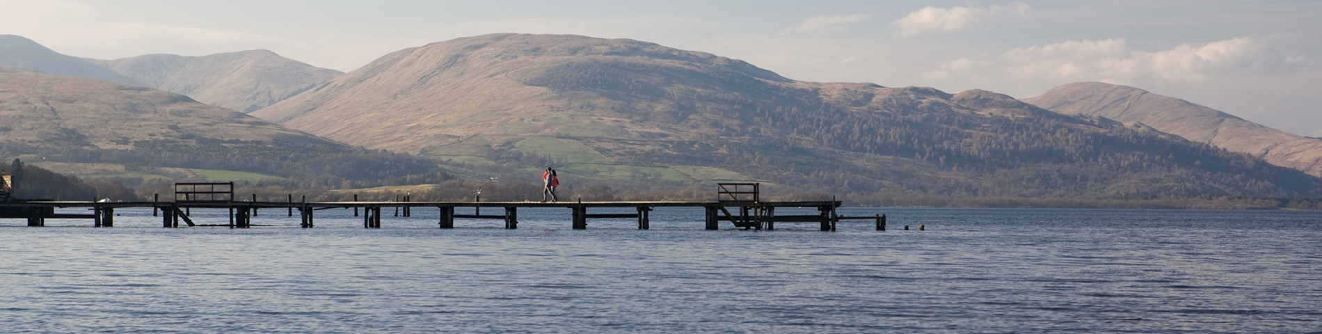 Pier on Loch Lomond with the hills in the background