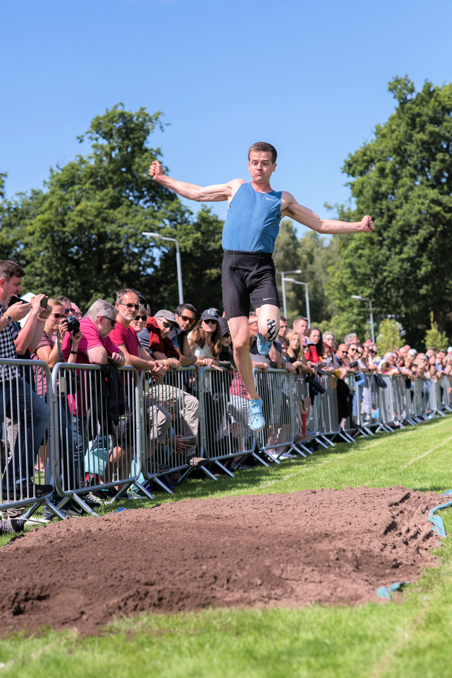image of Highland Games long jumper in mid air
