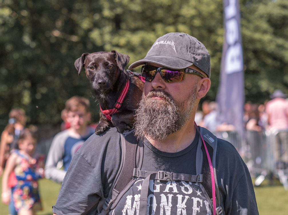 image of Highland Games man with dog on shoulder