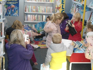 Lots of children looking at books in the mobile library