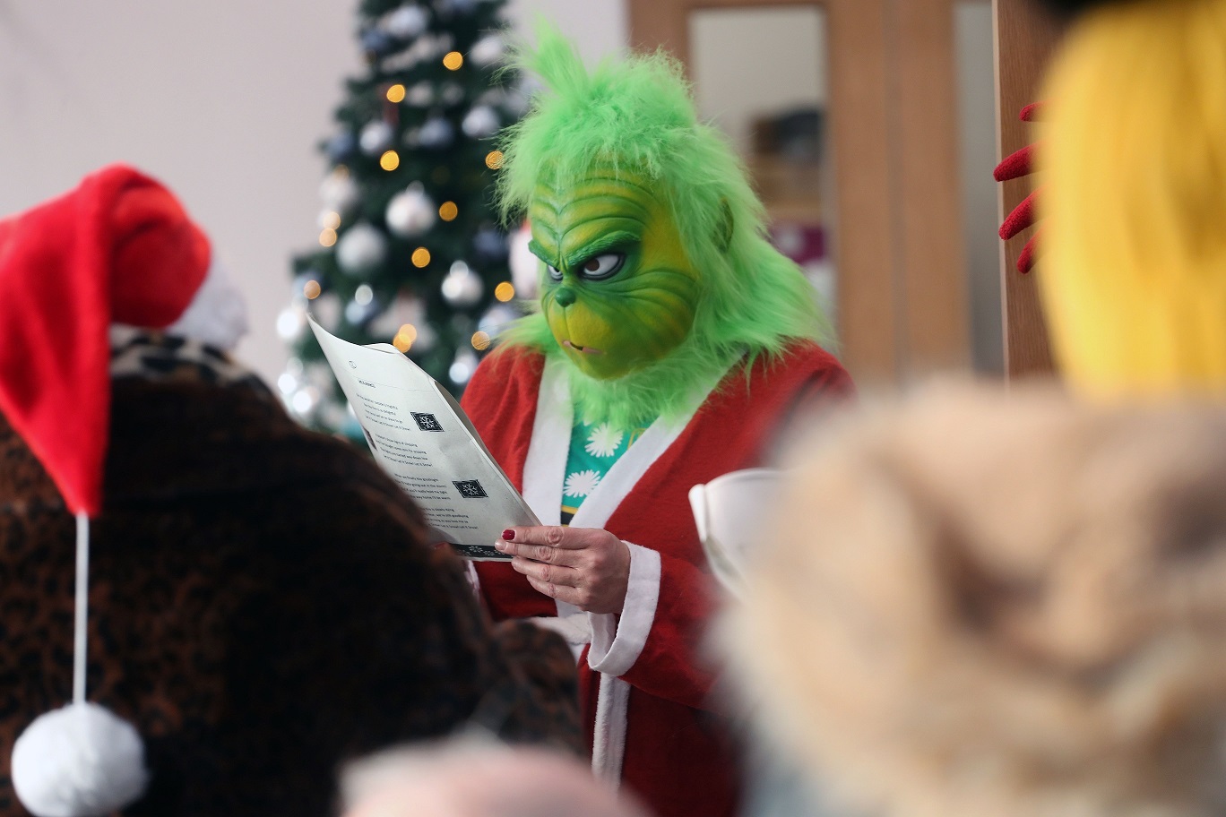 image of Grinch studying the Cafe menu