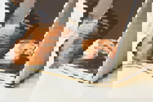Pay an invoice on a laptop