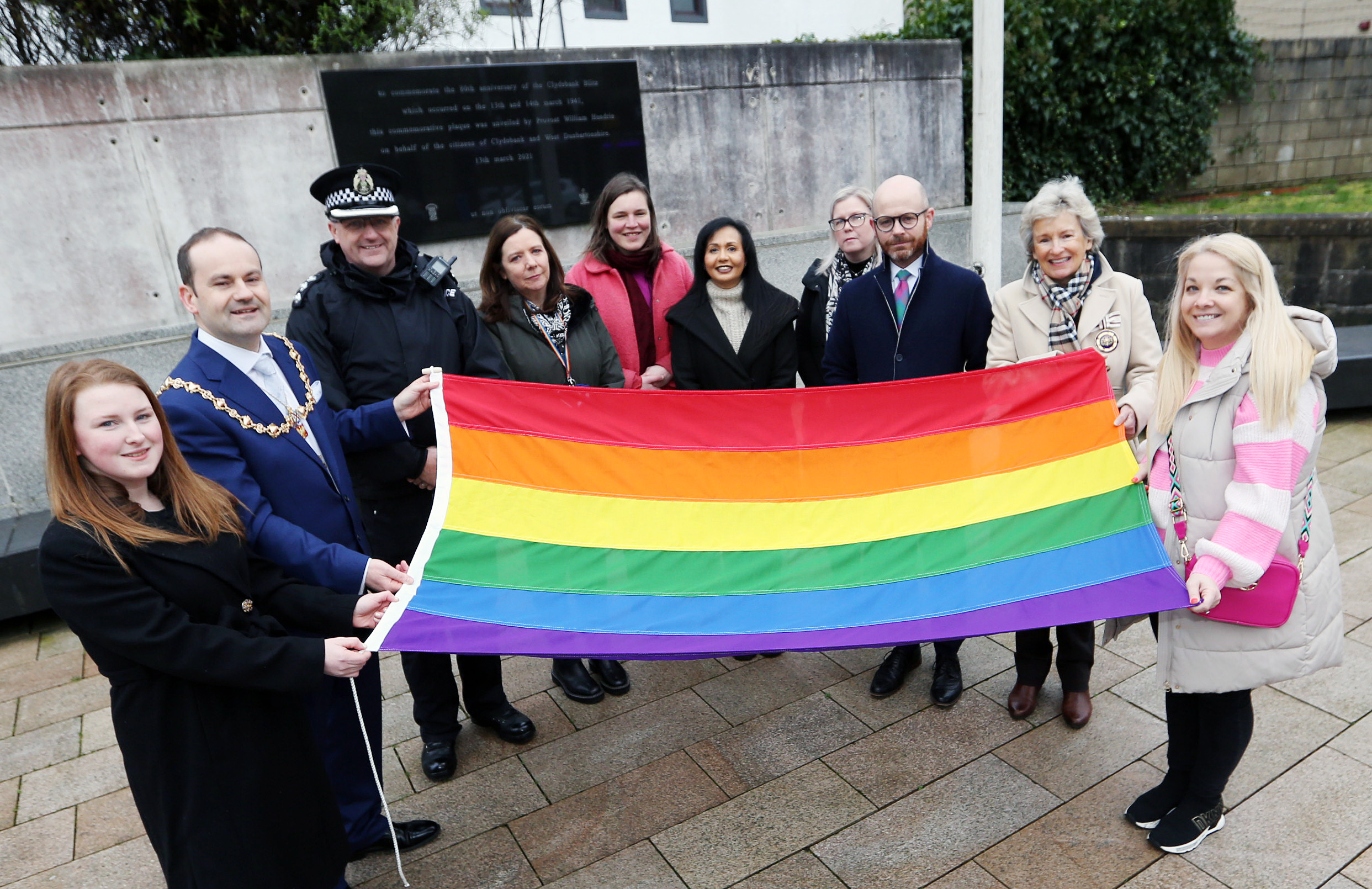 Provost Douglas McAllister led elected members and local residents in a flag-raising ceremony in Clydebank to mark LGBT+ History Month.