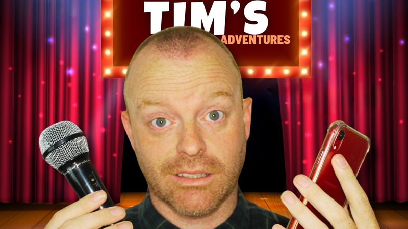 Tiny Tim poster holding mic and phone