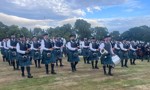 Inverary and District Pipe Band march past after being named overall winners of the Scottish Pipe Band Championships