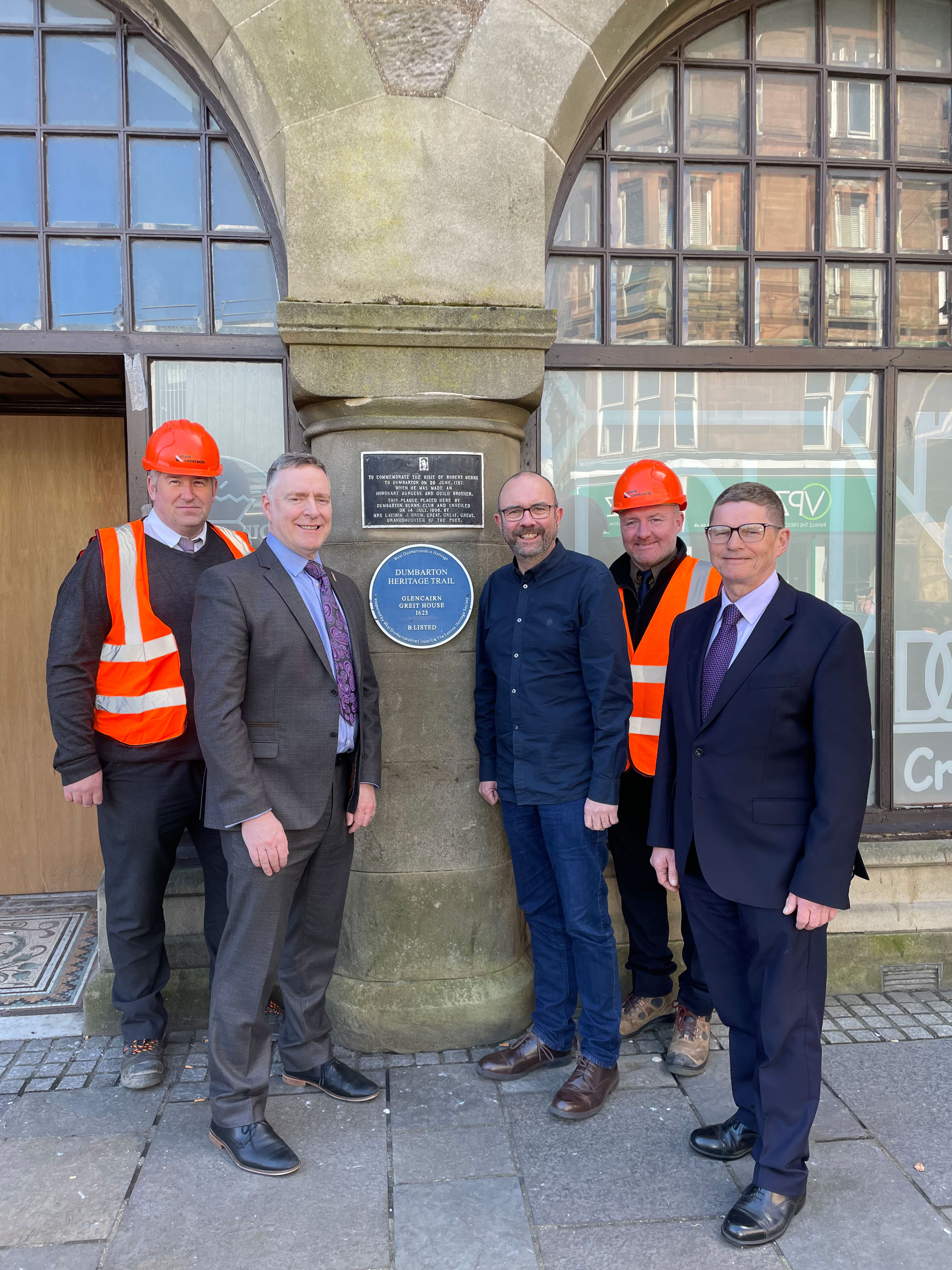 Front of Glencairn House - Chief executive Peter Hesset, Councillor Mcbride and Martin Rooney and workers