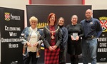 Provost Karen Murray Conaghan on stage with winners Annette McPhie and Loch Lomond Rescue Boat Volunteers