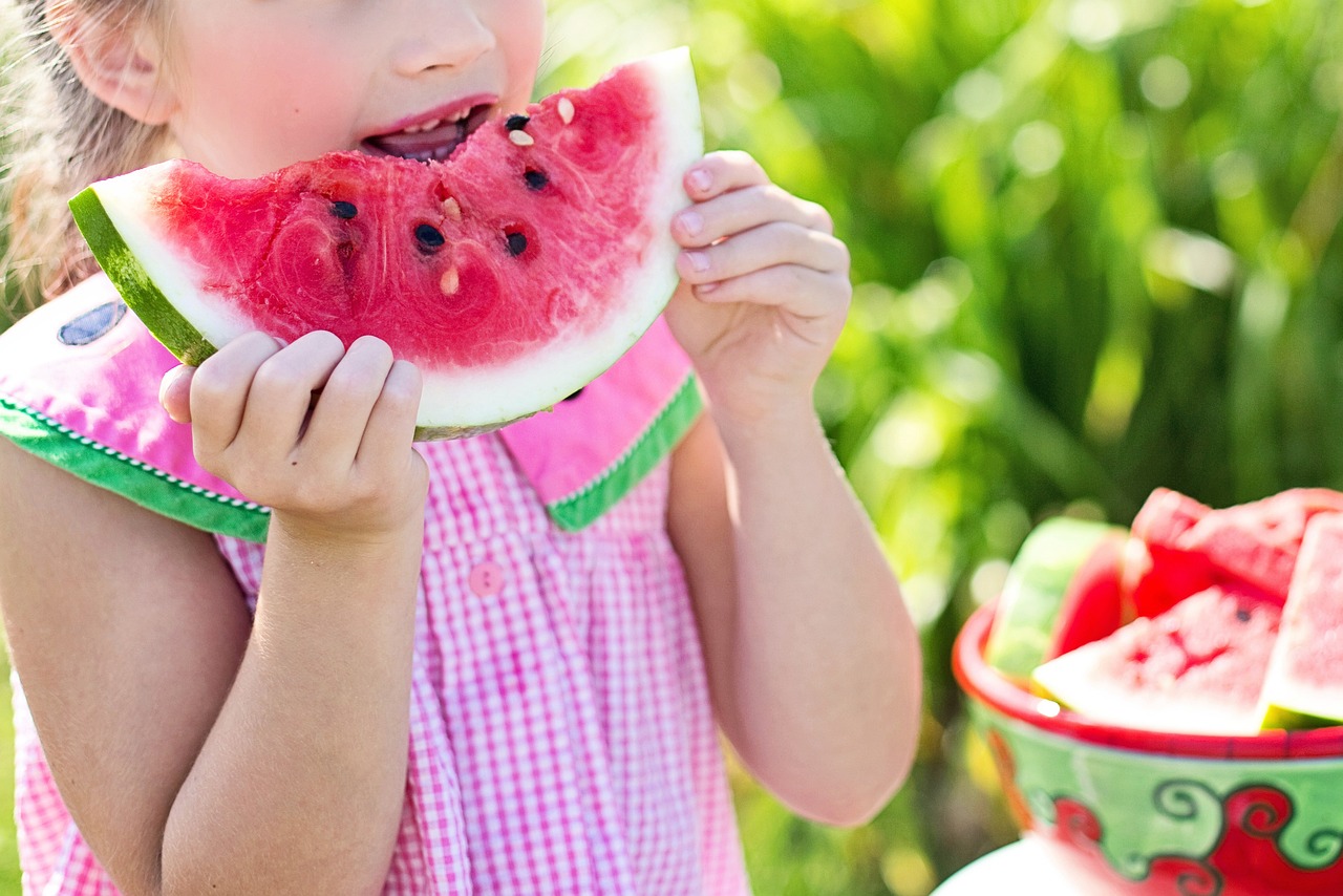 Girl eating watermelon for WD schools wellbeing project