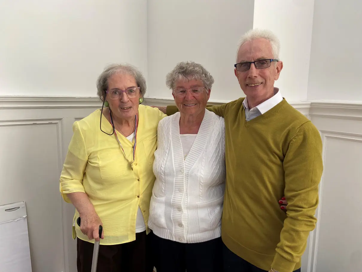 Three Scrutiny Panel members, Jim, Cathy, and June, smiling at a meeting.