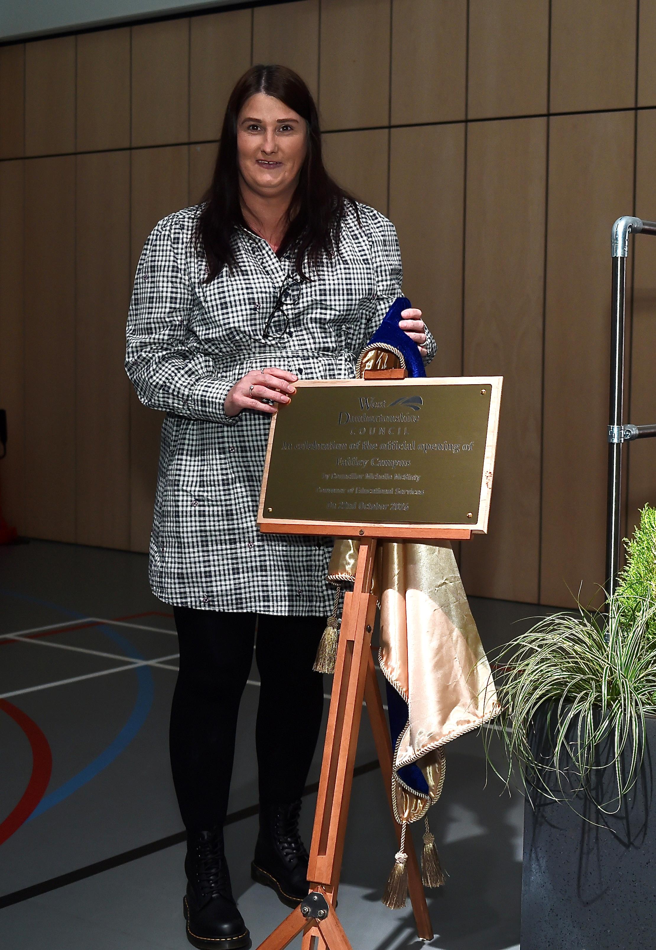 Councillor Michelle McGinty unveils a plaque after officially opening Faifley Campus