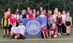 Primary school pupils, teachers, councillors and Active Schools staff with Gold School Sport Awards in West Dunbartonshire.