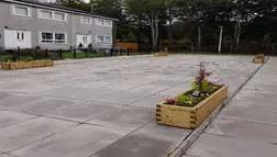 Photo of new planters being installed at Faifley.