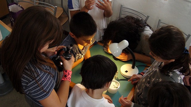 Children gathered learning science